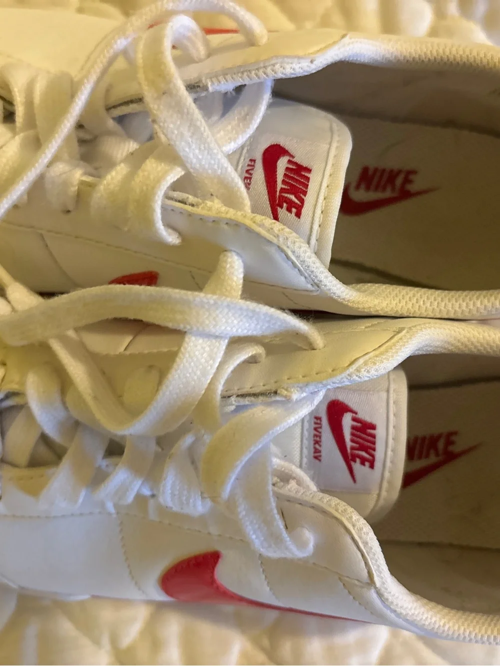 Nike White Sneakers with Pink Swoosh Accents